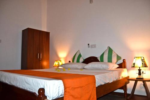 A bed or beds in a room at Ocean Breeze Villa
