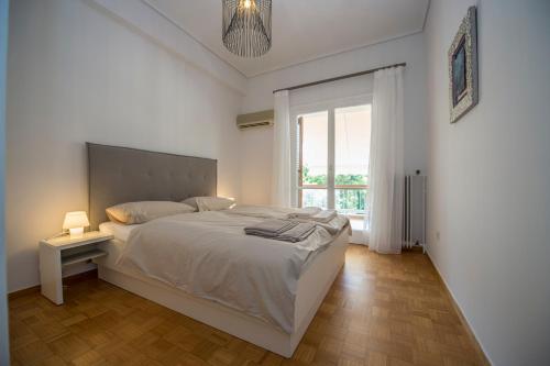 Posteľ alebo postele v izbe v ubytovaní Starapartment Athens-Varkiza Top 2