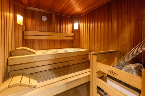 a wooden sauna with two wooden benches in it at Hotel Jezero in Plitvička Jezera