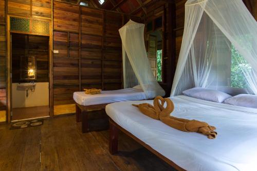Letto o letti in una camera di Art's Riverview Lodge