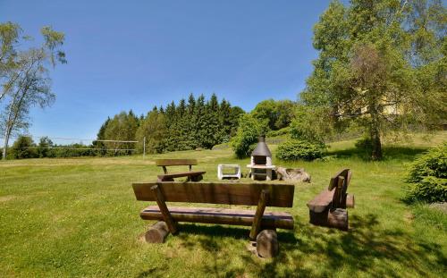 a park bench with a lamp on a field at Jánské kameny - Johannisstein in Krompach