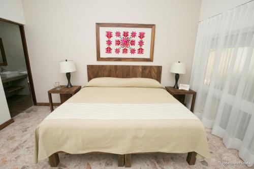 Кровать или кровати в номере Hotel Casa Ortiz