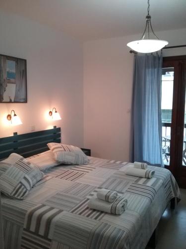 Postel nebo postele na pokoji v ubytování Mouria Hotel