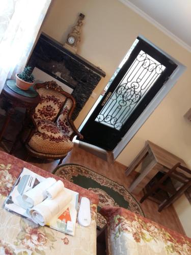 an overhead view of a living room with a fireplace at Guest House Panda in Kutaisi