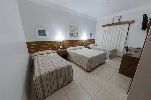 Postel nebo postele na pokoji v ubytování Real Palace Hotel