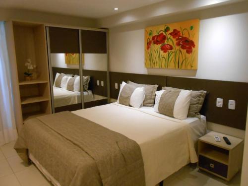 Tabatinga Residence Apart Hotel tesisinde bir odada yatak veya yataklar