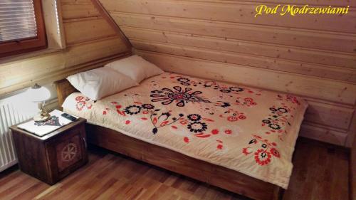 Postel nebo postele na pokoji v ubytování Pod Modrzewiami