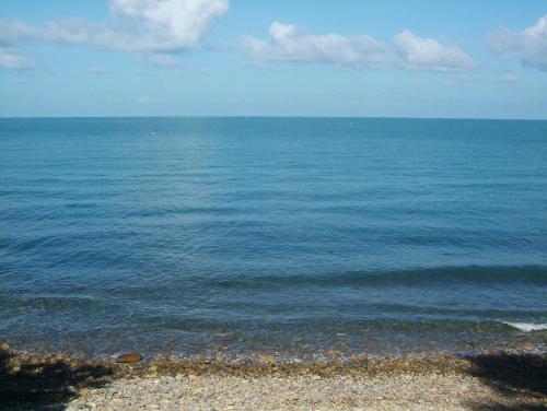 a view of the ocean from a rocky beach at Paradise Palms in Ko Chang