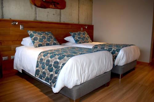 Ένα ή περισσότερα κρεβάτια σε δωμάτιο στο Hotel Amun