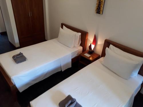 Postel nebo postele na pokoji v ubytování Dream Divers Resort