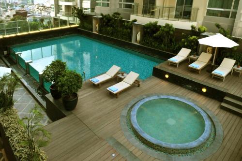 an overhead view of a swimming pool on a building at Cambridge Hotel Medan in Medan
