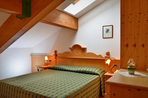 Giường trong phòng chung tại Residence Taufer
