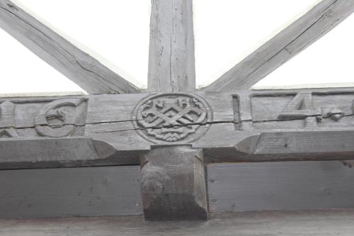 a wooden beam on top of a building at Alter Topf in Quedlinburg