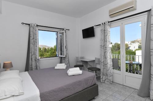 Ένα ή περισσότερα κρεβάτια σε δωμάτιο στο Villa Katerina
