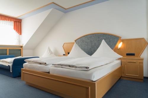 Säng eller sängar i ett rum på Landgasthof Zum Stern