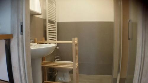 a bathroom with a toilet and a sink at Casa Martini in Mogliano Veneto