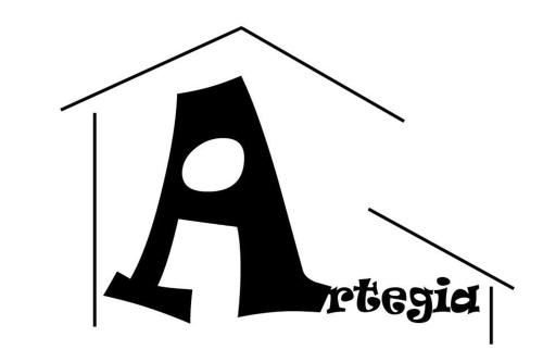 a letter k in a house logo at Casa Artegia in Mezkiriz
