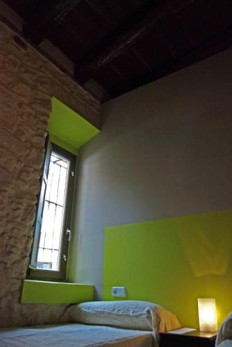 a room with two beds and a window at Hosteria Natura Plaza in Segovia