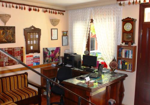 a room with a desk with a computer on it at Hotel Peninsula in Istanbul
