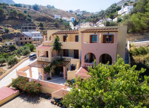a view of a house with a mountain at Amphitrite in Myrties