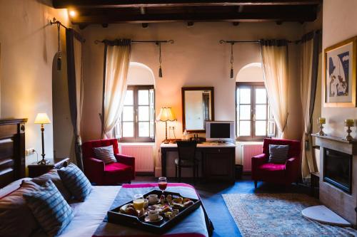a living room with a couch and a table at Trikolonion Country Stemnitsa in Stemnitsa
