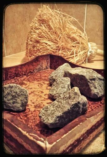a painting of rocks on top of a box at At Gil's and Galit's Place- Hospitality, Health and Spa in Bruchim Qela' Alon