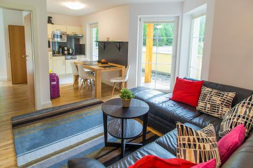 a living room with a couch and a table at Residenz Zwieselstein App.11 in Sölden