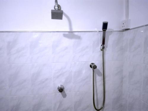 a shower in a bathroom with a shower head at Elliot Nature Resort in Galle