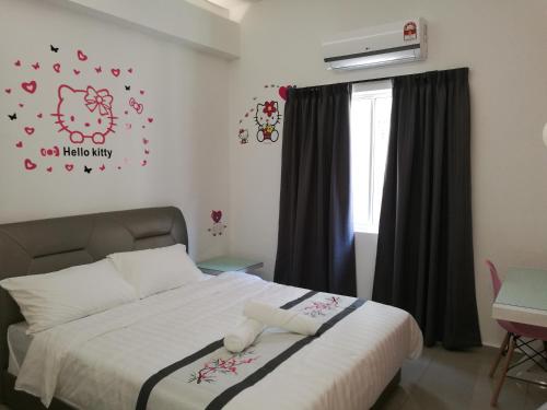 Ένα ή περισσότερα κρεβάτια σε δωμάτιο στο D' Cozy Inn