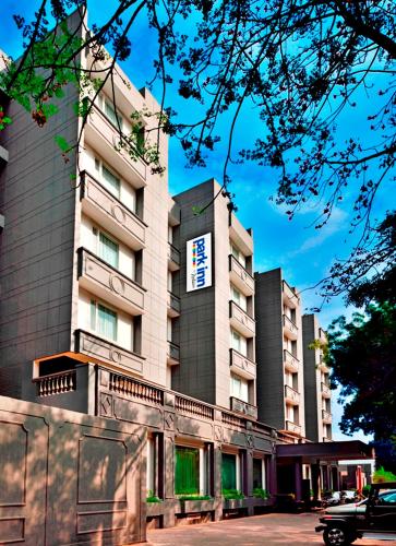 a building with a sign on the side of it at Park Inn by Radisson,South Delhi in New Delhi