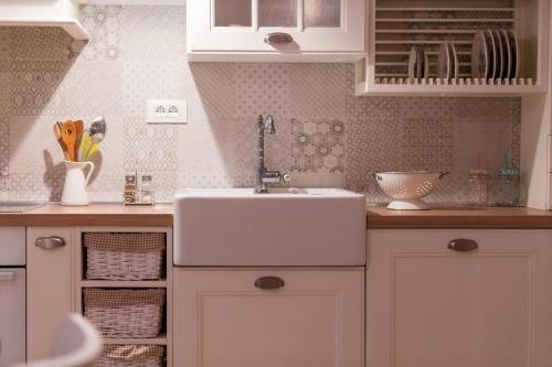 a kitchen with a sink and a counter top at Villa Lemon & Mint in Komiža