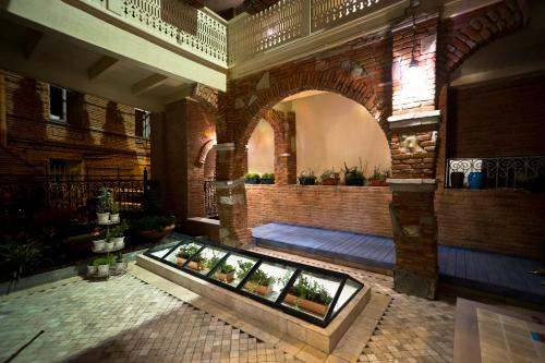 a building with a display of plants in a room at No12 Boutique Hotel in Tbilisi City