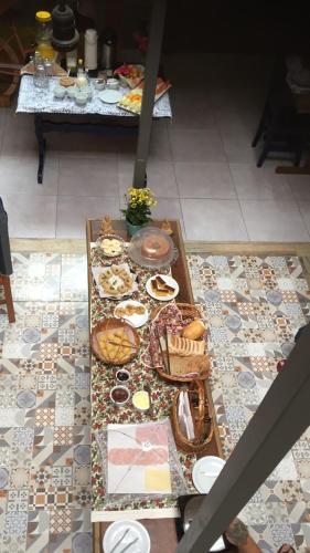 a table with many different types of food on it at Alma Brava in Itajaí