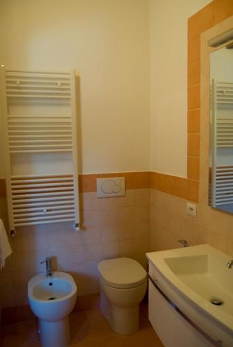 a bathroom with a toilet and a sink at Agriturismo Il Falco in SantʼElpidio a Mare