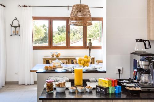 a kitchen with a counter with some food on it at Agroturismo Ses Vistes in Porreres