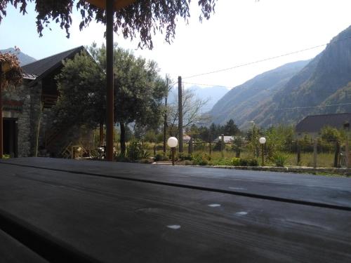 an empty road with mountains in the background at Guest House Flodisa in Theth