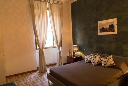 Кровать или кровати в номере Trastevere Corner Eight