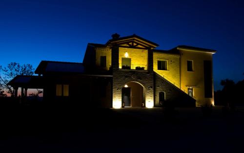 a building lit up at night at Agriturismo Il Falco in SantʼElpidio a Mare