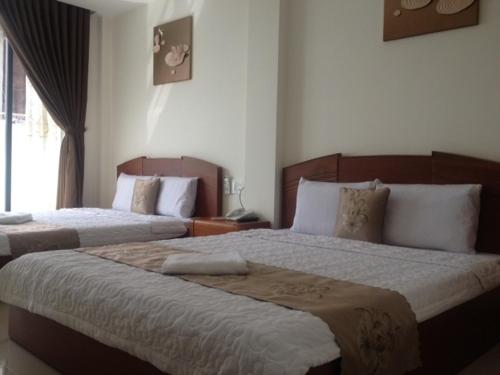 Au Lac Hotelにあるベッド