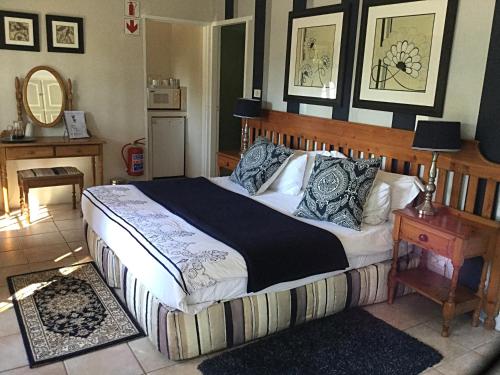 Ένα ή περισσότερα κρεβάτια σε δωμάτιο στο Warrens Guest House