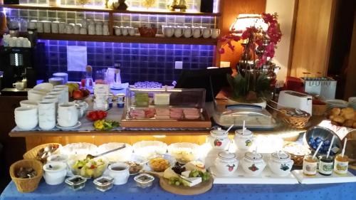 a table with a buffet of food on it at Sportpension Christina by PiaundDirk in Fügen
