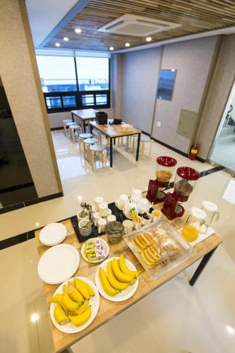 a table with bananas and other food on it at O'guest in Haeundae in Busan