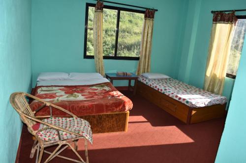 מיטה או מיטות בחדר ב-Tashidelek Guest Lodge & House