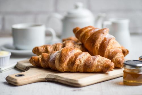 a bunch of croissants sitting on a cutting board at Black Horse Inn in Northallerton