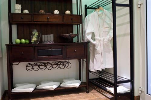 a room with a mirror and a shelf with towels at Amadeus in Łomża