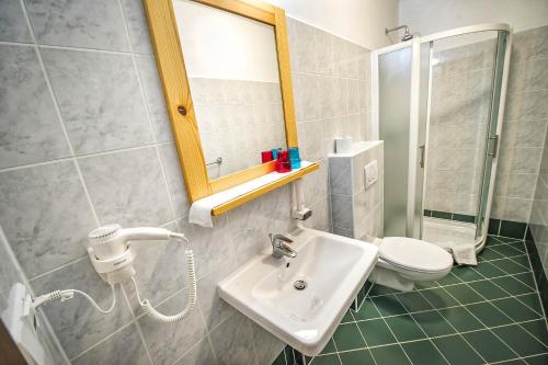a bathroom with a sink and a toilet at Villa Krejza in Smokovce