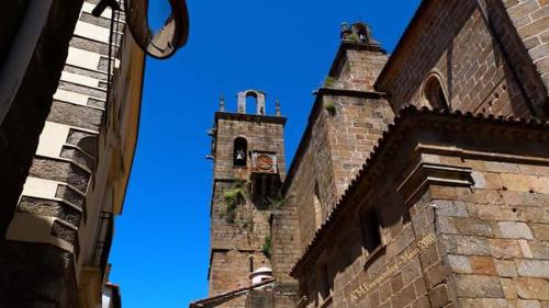 an old brick building with a clock tower at Apartamento Zocailla in Gata