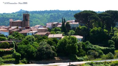 a small town with trees and houses on a hill at Apartamento Zocailla in Gata