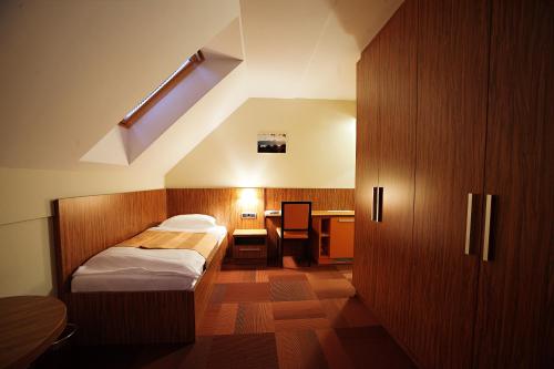 Postel nebo postele na pokoji v ubytování Hotel Marinšek