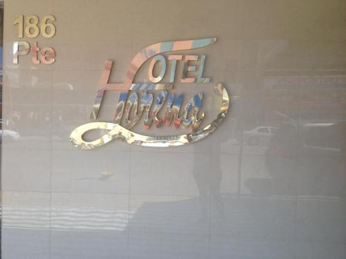 a store window with a sign that says lease at Hotel Lorena in Los Mochis